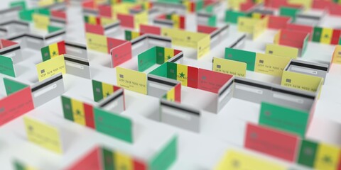 Obraz premium Flag of Senegal on the mockup credit card maze. Financial problems related 3D rendering