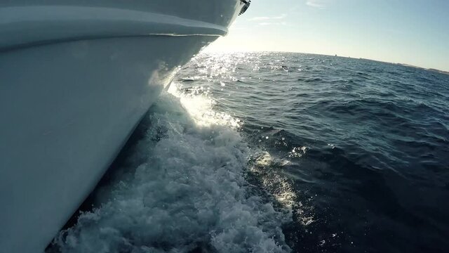 Sea trip travel journey tour on a tourist white yacht in the sea ocean. Waves near the sides of the ship 