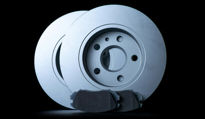 Car accessories. New metal car part. Auto motor mechanic spare or automotive piece isolated on black background. Technology of mechanical gear with space for text.