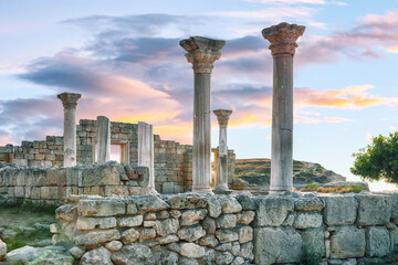 Fantastic sunset over ruins of the Basilica in ancient city Chersonese - national historical and archaeological reserve.