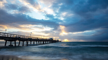 Fototapeta na wymiar Pompano Beach Pier Broward County Florida stormy weather and sunrise