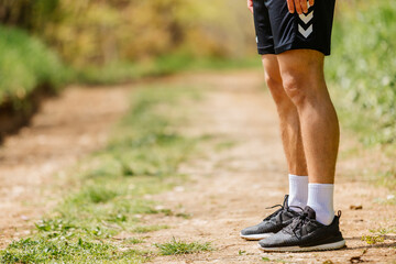 Sport man running. Portrait of runner man jogging in park. Sport workout outdoor. Athlete training run exercise
