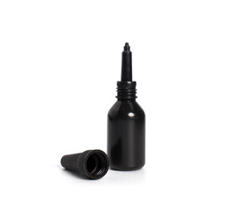 Black oil dropper bottle with blank label isolated on white background. Packaging for medical and cosmetic liquids.