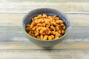 Turkish roasted paprika corn nuts in ceramic snack bowl on table