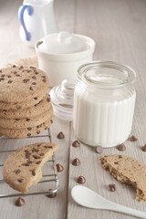 breakfast of freshly baked chocolate chip cookies on a metal rack with fresh milk for hunting