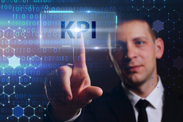 Business, Technology, Internet and network concept. Young businessman working on a virtual screen of the future and sees the inscription: KPI