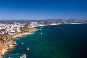 "Ponta da Piedade" - Portuguese southern golden coast cliffs. Aerial view over city of Lagos in Algarve, Portugal.