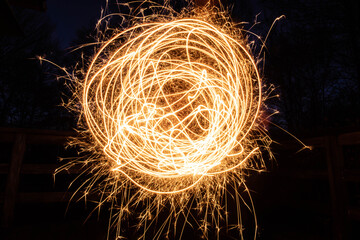 Abstract light trail art in night setting, long exposure 