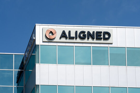 
Burlington, Ontario, Canada - May 15, 2021: Close up of Aligned sign on their head office building in Burlington, Ontario, Canada. Aligned Capital Partners Inc. (ACPI) is an investment dealer in Cana