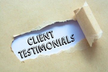 Text Client Testimonials appearing behind ripped brown paper.