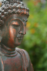 Buddha Statue in Outdoor Garden With Blurred Background
