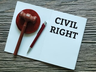 Phrase CIVIL RIGHT act written on notebook with a pen and gavel.