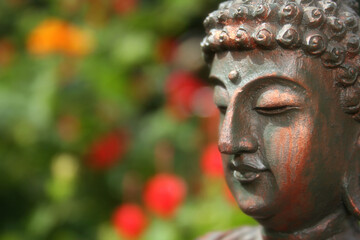 Buddha Statue in Outdoor Garden With Blurred Background