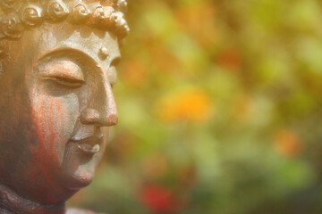 Buddha Statue in Outdoor Garden With Blurred Background