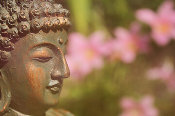 Buddha Statue in Outdoor Garden With Blurred Background