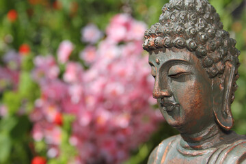 Buddha Statue in Outdoor Garden With Blurred Background
