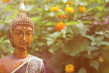 Buddha Statue in Outdoor Garden With Blurred Background