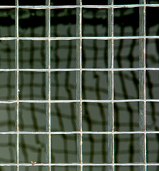 Galvanized steel grate drain close up. Iron grating pattern. Grid. Abstract. Background.
