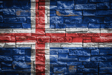National flag of Iceland on stone  wall background.The concept of national pride and symbol of the...