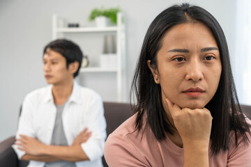 Asian women are disappointed and saddened after an argument with their husband. Asian couples are having family problems resulting in divorce. Love problem