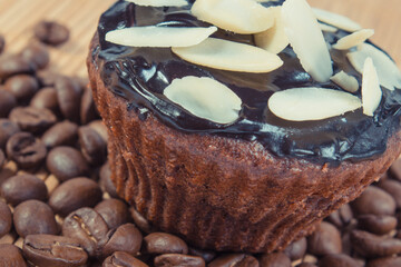 Fresh muffins with chocolate, coffee and dried sliced almonds. Delicious dessert