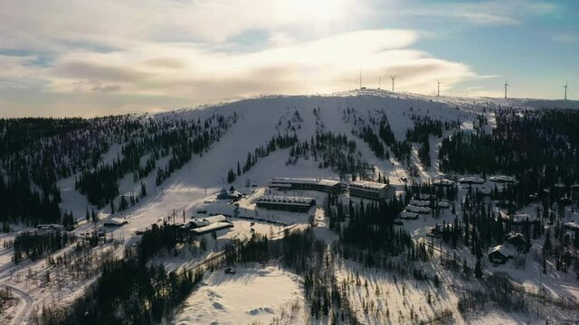 Aerial view around the Olostunturi ski center, in Lapland - circling, drone shot