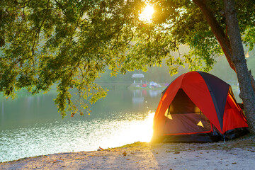 Tourist tent in Camping among meadow in the mountain near lake at national park © CasanoWa Stutio