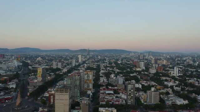 Aerial Shot of Glorieta Ninos Heroes in Guadalajara, Mexico at Sunset. Truck Left
