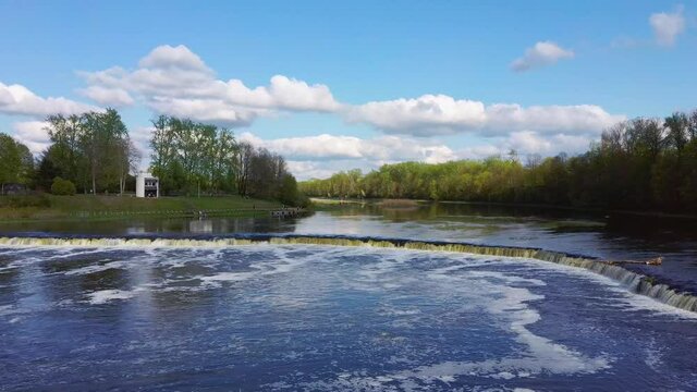 Flying Fish at Ventas Rumba Waterfall. The Widest Waterfall in Europe in Latvia Kuldiga Also Called Goldingen on River Venta. Aerial Dron Shot