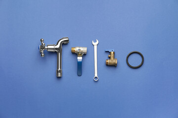 Set of plumber's items on color background