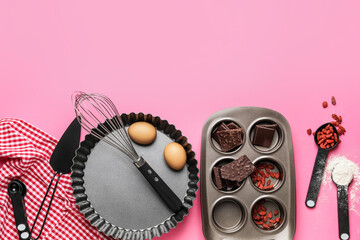 Ingredients for preparing bakery and kitchen utensils on color background