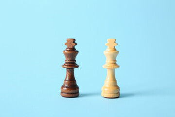 Wooden kings on color background