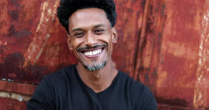 Happy black man smiling. Friendly African portrait person