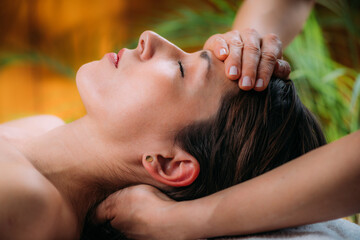 Craniosacral Therapy Massage. Therapist Massaging Woman’s Forehead. - obrazy, fototapety, plakaty