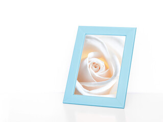 Light blue color photo frame with beautiful white rose picture