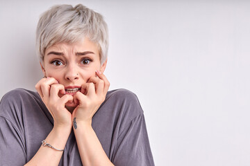 Portrait of frightened woman looking with fear eyes wide open. terrified, stressed, scared to death...