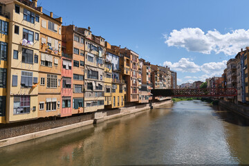 Fototapeta na wymiar colorful houses on the river onyar passing through the old town of girona, catalunya, spain
