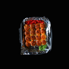 a portion of food top view on a black background