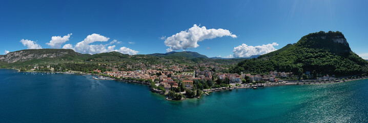 Obraz premium Panorama on corno. Top view of the Museum of Lake Garda on the coastline. Aerial view of the city of Garda, Lake Garda, Italy. Vista lago on the coastline.