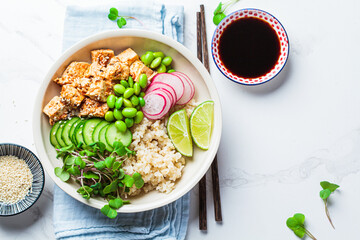 Vegan poke bowl with tofu, brown rice, beans and vegetables. Plant-based diet concept.