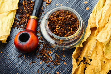 Smoking pipe with tobacco leaves