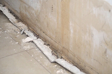 the building wall damaged by moisture and water, water and moisture on the walls of the building,