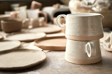 Pottery studio The process of creating pottery. The master ceramist works in her studio. workplace of potter