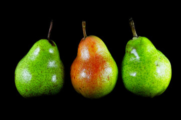 Fototapeta na wymiar Pear on black background close-up. Food, fruit, vitamins, ripe, healthy, macro, harvest