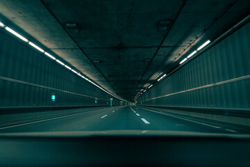 Driving through an empty underground tunnel in the teal and orange film look.