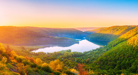 Vivid sunrise landscape in the national nature park Podilski Tovtry, canyon and Studenytsia river is tributary of Dnister river, view from above