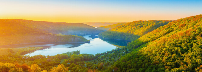 Vivid sunrise landscape in the national nature park Podilski Tovtry, canyon and Studenytsia river is tributary of Dnister river, view from above