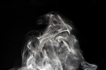 cloud of white smoke on black background