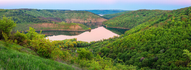 Sunset landscape in the national nature park Podilski Tovtry, canyon and Studenytsia river is tributary of Dnister river, view from above