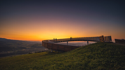 Picturesque sunset in Beskid Sądecki seen from the tower in Wola Krogulecka, with views of the mountains and fields. © PawelUchorczak